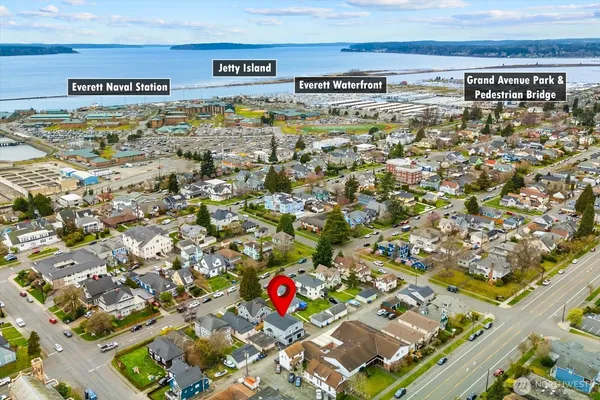 a view of a house with a palm tree