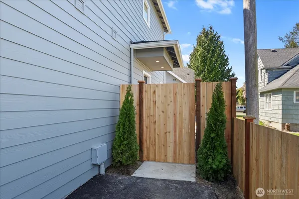a view of a house with a door and wooden walls