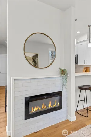 a living room with a fireplace and a table