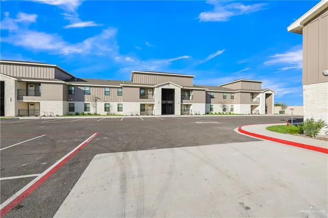 a view of residential houses with yard