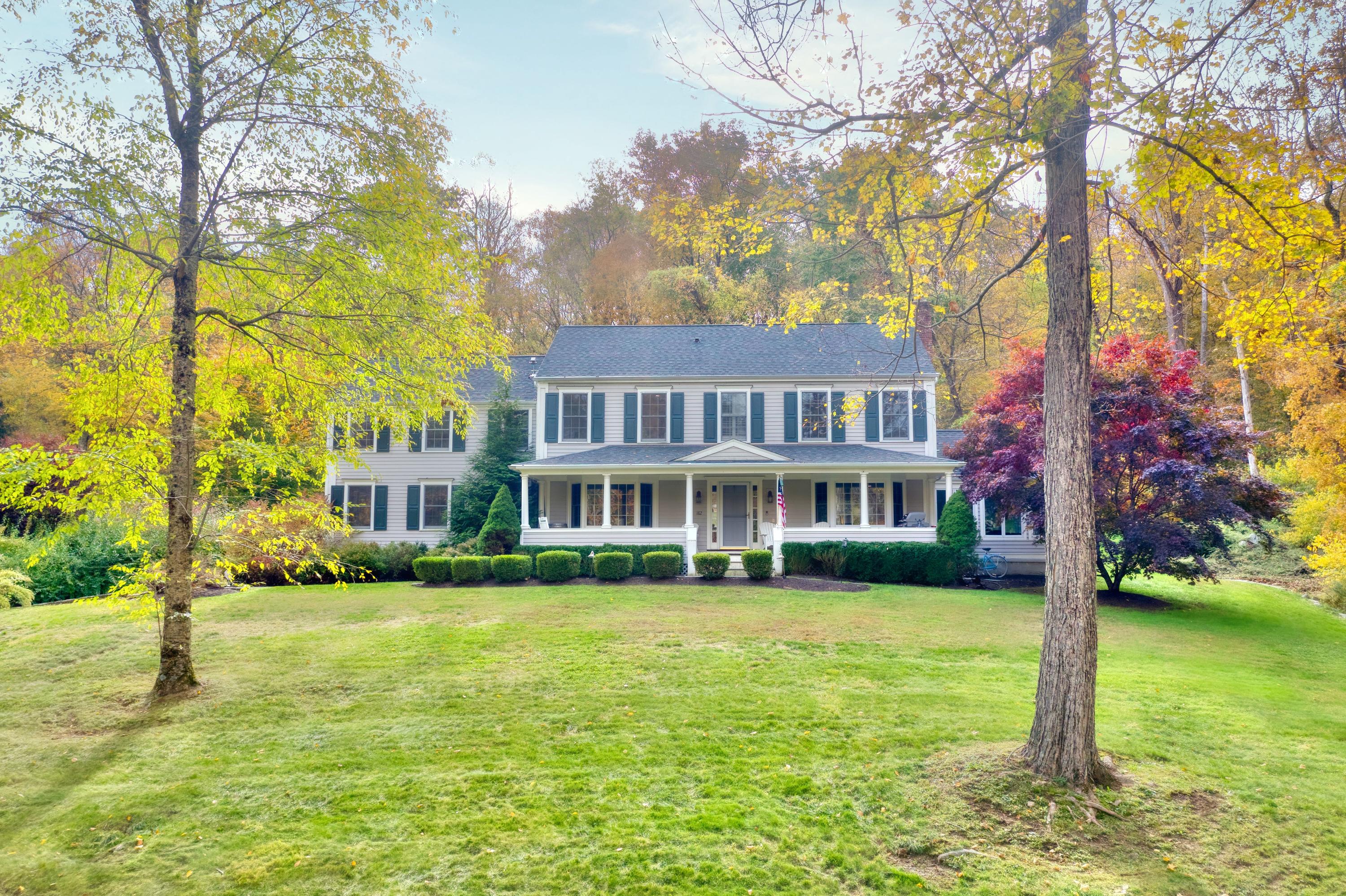 182 Deep Valley Road New Canaan, CT 06840 - Photo 1 of 34 a view of a house with a yard