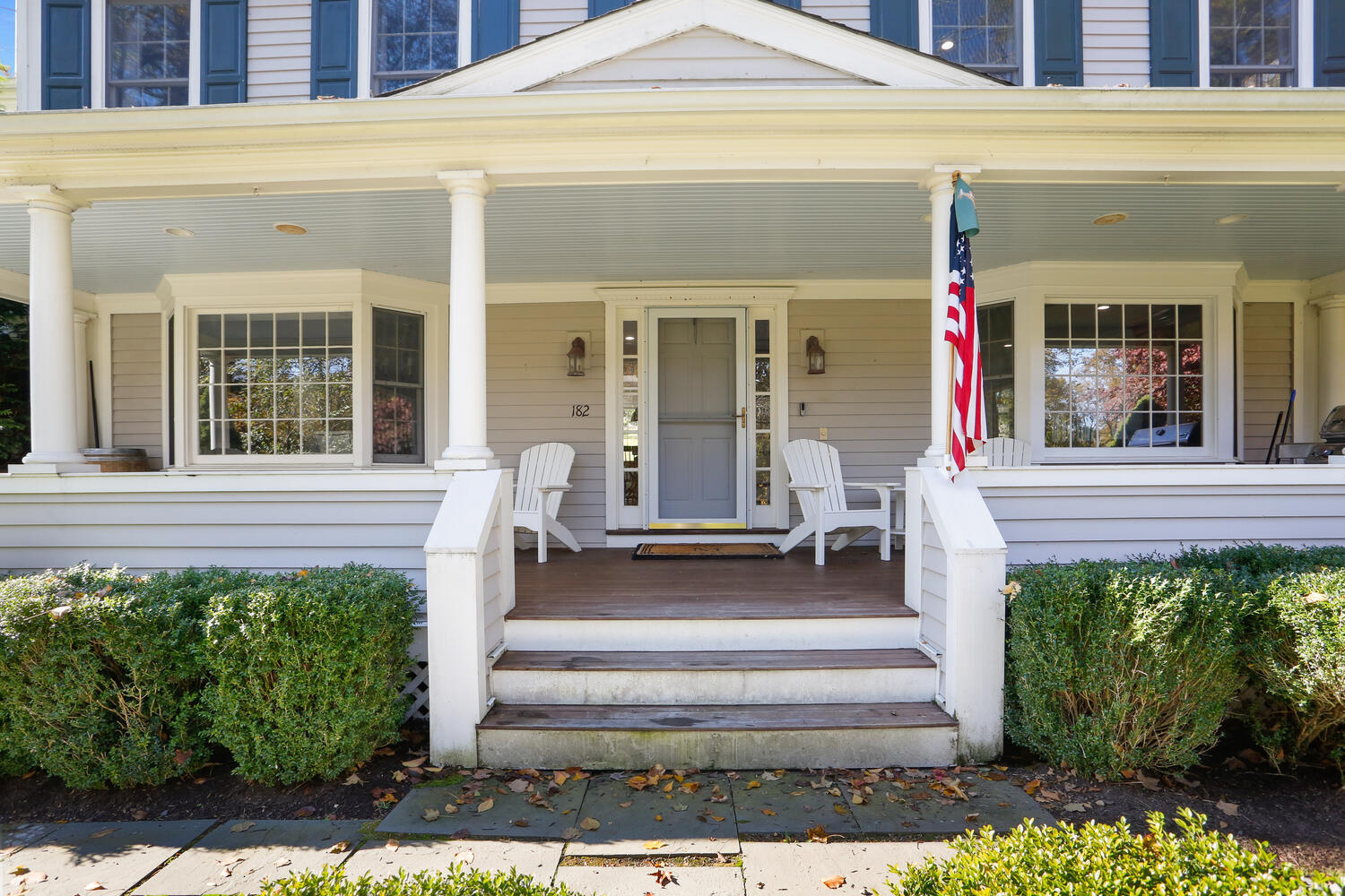 182 Deep Valley Road New Canaan, CT 06840 - Photo 2 of 34 a front view of a house with a porch