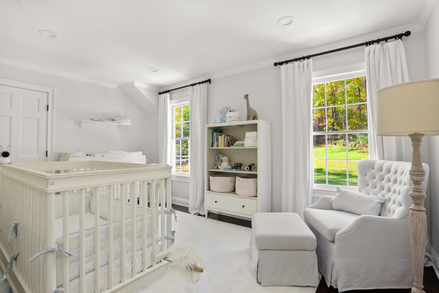 182 Deep Valley Road New Canaan, CT 06840 - Photo 16 of 34 a spacious bedroom with a bed and a window
