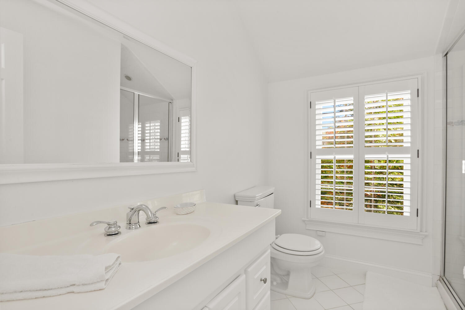 182 Deep Valley Road New Canaan, CT 06840 - Photo 17 of 34 a bathroom with a sink a toilet and a window