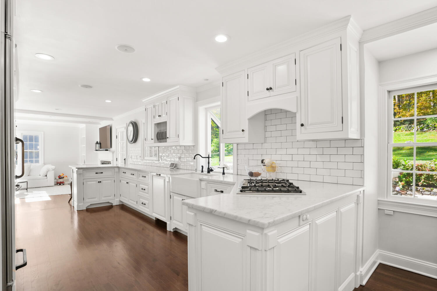 182 Deep Valley Road New Canaan, CT 06840 - Photo 7 of 34 a kitchen with granite countertop a white cabinets stove and refrigerator