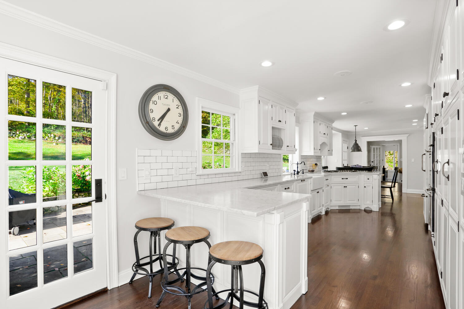 182 Deep Valley Road New Canaan, CT 06840 - Photo 8 of 34 a large white kitchen with a large window