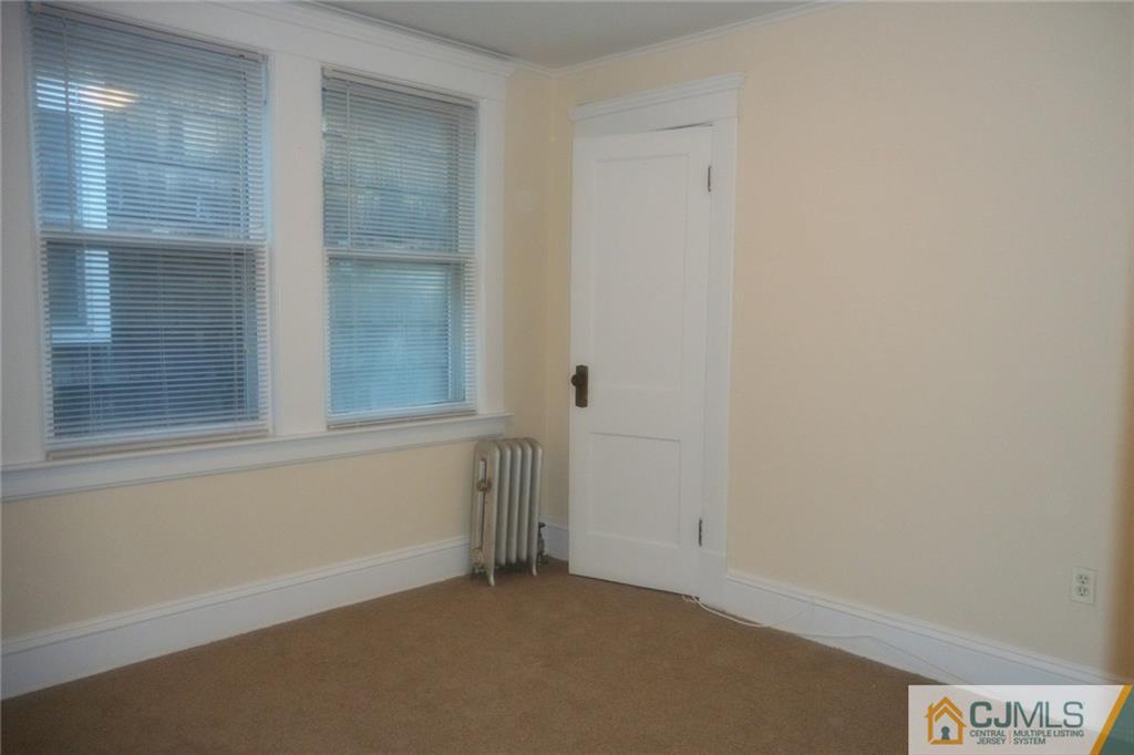 122 A Rector Street Perth Amboy, NJ 08861 - Photo 14 of 23 an empty room with windows