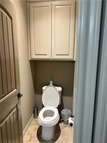 a bathroom with a toilet and a sink