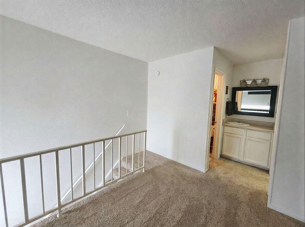 701 West 25th Street, Unit 1 Austin, TX 78705 - Photo 7 of 7 a view of a hallway with bathroom and wooden floor