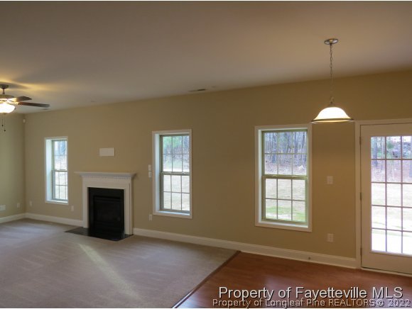 44 Golden Rod (lot 65) Cir Spring Lake Spring Lake, NC 28390 - Photo 5 of 13 an empty room with windows and fireplace