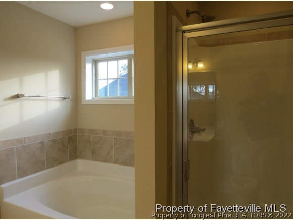 44 Golden Rod (lot 65) Cir Spring Lake Spring Lake, NC 28390 - Photo 10 of 13 a bathroom with a bathtub