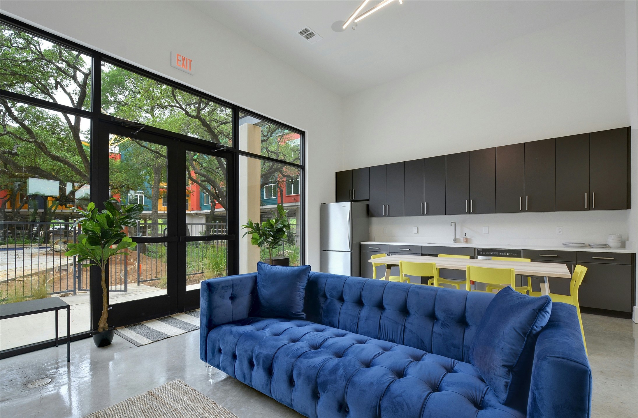 13130 Pond Springs Road, Unit 1105 Austin, TX 78729 - Photo 12 of 22 a living room with furniture and a large window