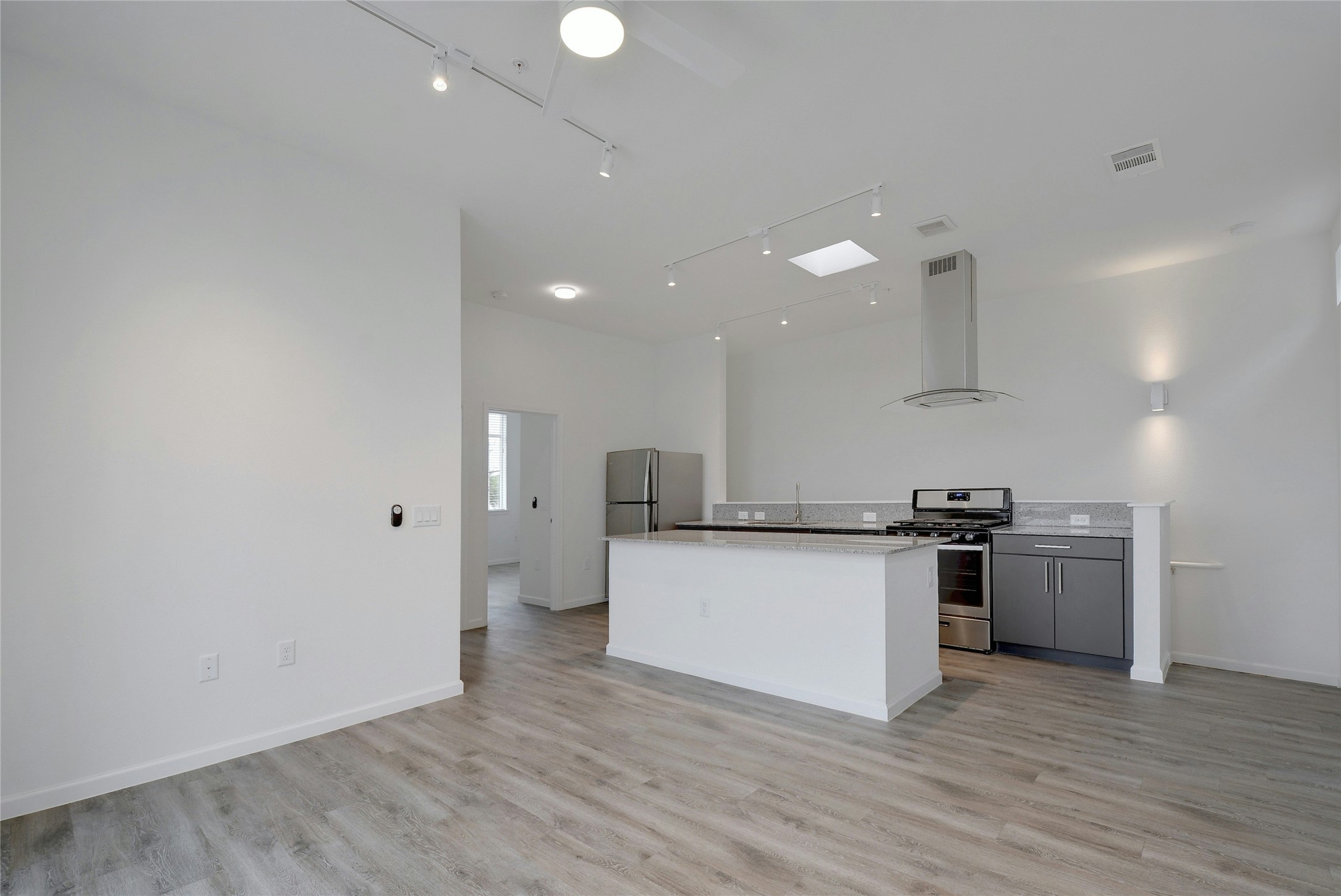 13130 Pond Springs Road, Unit 1105 Austin, TX 78729 - Photo 22 of 22 a kitchen with stainless steel appliances a stove top oven a sink and a refrigerator