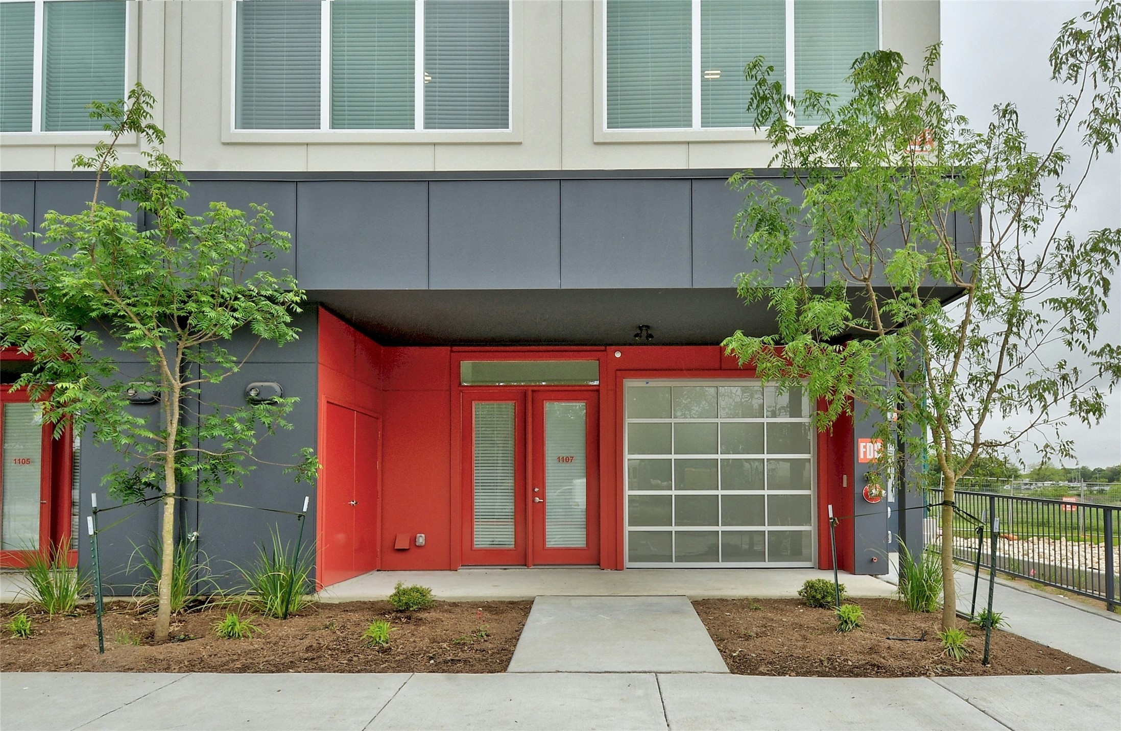 13130 Pond Springs Road, Unit 1105 Austin, TX 78729 - Photo 5 of 22 a front view of a house with a yard