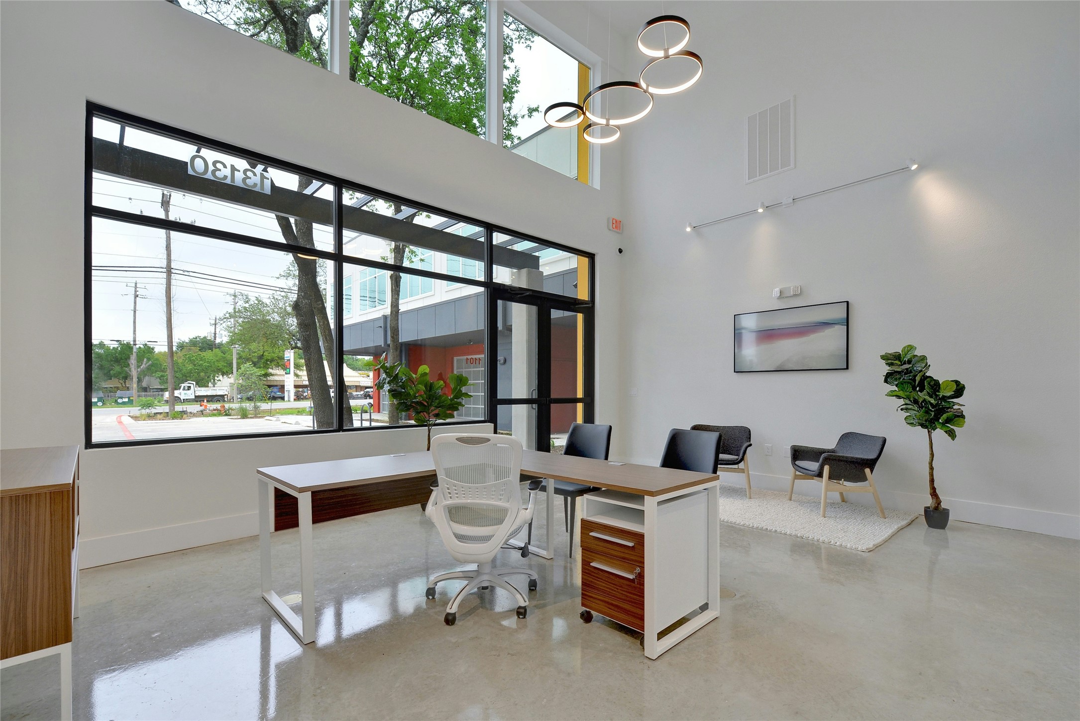 13130 Pond Springs Road, Unit 1105 Austin, TX 78729 - Photo 10 of 22 a living room with furniture and a large window