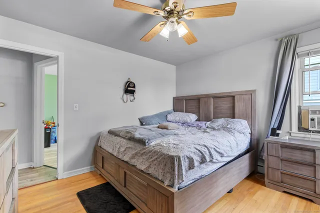 a bedroom with a bed and window