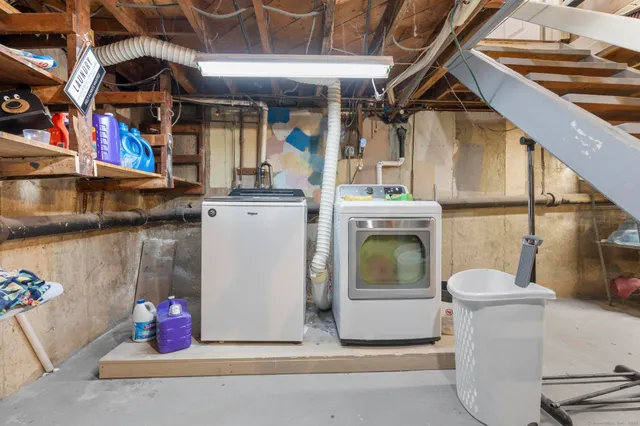 a view of a patio with table and chairs with wooden floor and fence