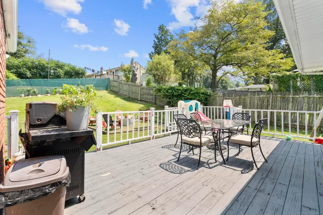 a view of a chairs and table in the patio