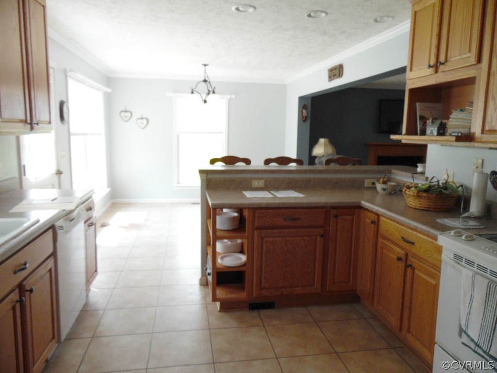 11795 Lunenburg County Road Keysville, VA 23947 - Photo 6 of 28 a kitchen with a sink and a stove top oven with wooden floor