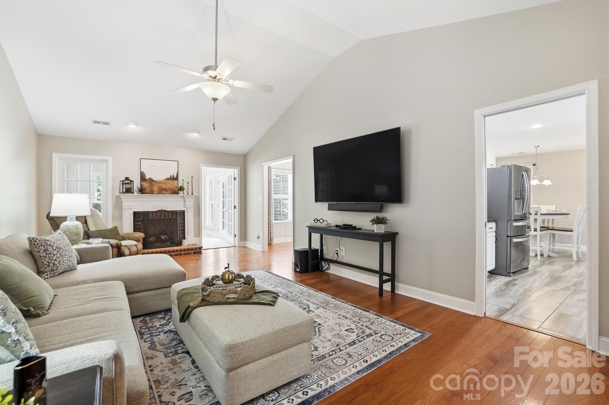 3324 Muddy Creek Road Midland, NC 28107 - Photo 7 of 46 a living room with furniture and a flat screen tv