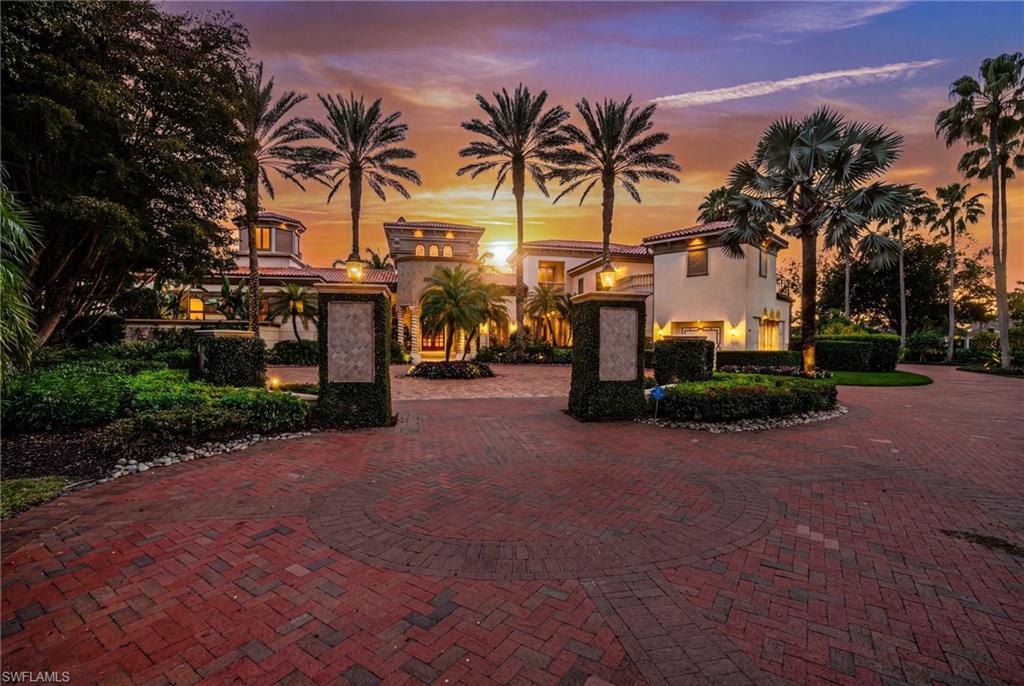 28920 Cavell Terrace Naples, FL 34119 - Photo 1 of 50 a row of palm trees and a swimming pool