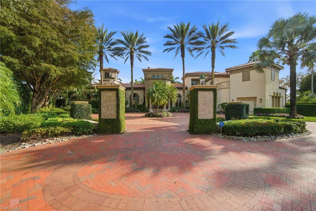28920 Cavell Terrace Naples, FL 34119 - Photo 2 of 50 a front view of multiple houses with yard