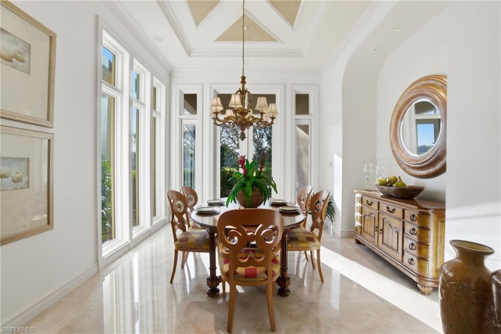 28920 Cavell Terrace Naples, FL 34119 - Photo 23 of 50 a view of a dining room with furniture window and wooden floor