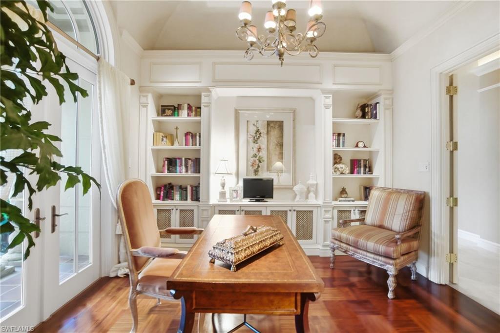 28920 Cavell Terrace Naples, FL 34119 - Photo 24 of 50 a view of a dining room with furniture wooden floor and chandelier