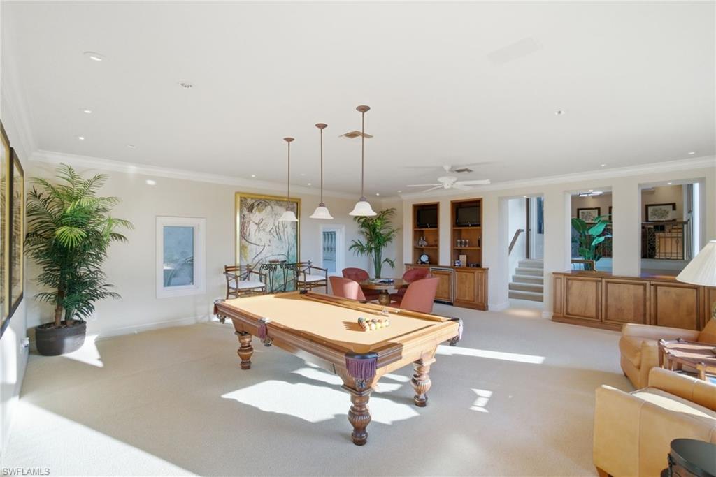 28920 Cavell Terrace Naples, FL 34119 - Photo 27 of 50 a living room with furniture a table and a potted plant