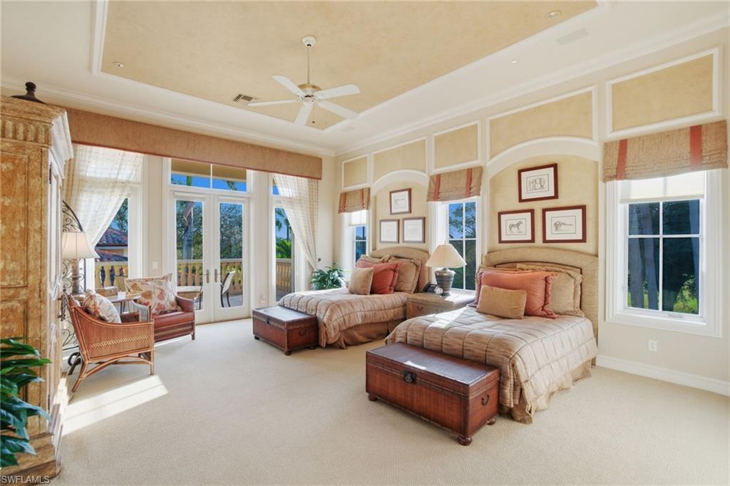 28920 Cavell Terrace Naples, FL 34119 - Photo 28 of 50 a spacious bedroom with a large bed and a couch