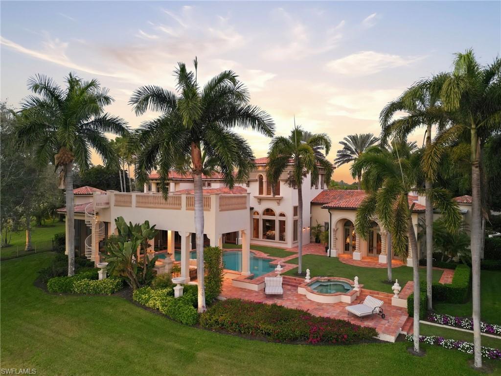 28920 Cavell Terrace Naples, FL 34119 - Photo 3 of 50 a view of a house with a swimming pool and sitting area