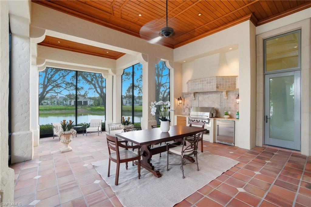 28920 Cavell Terrace Naples, FL 34119 - Photo 34 of 50 a room with lots of furniture and a large window