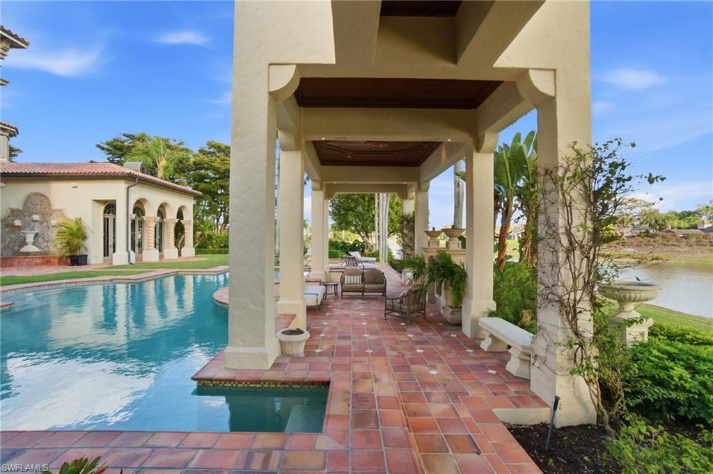 28920 Cavell Terrace Naples, FL 34119 - Photo 37 of 50 a front view of a house with garden