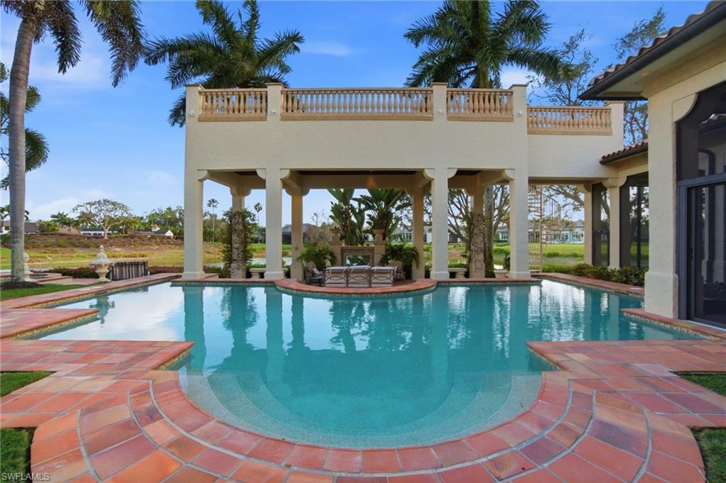 28920 Cavell Terrace Naples, FL 34119 - Photo 39 of 50 a view of a swimming pool with outdoor seating