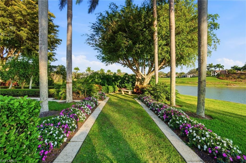 28920 Cavell Terrace Naples, FL 34119 - Photo 42 of 50 a view of a potted flower in a yard with swimming pool