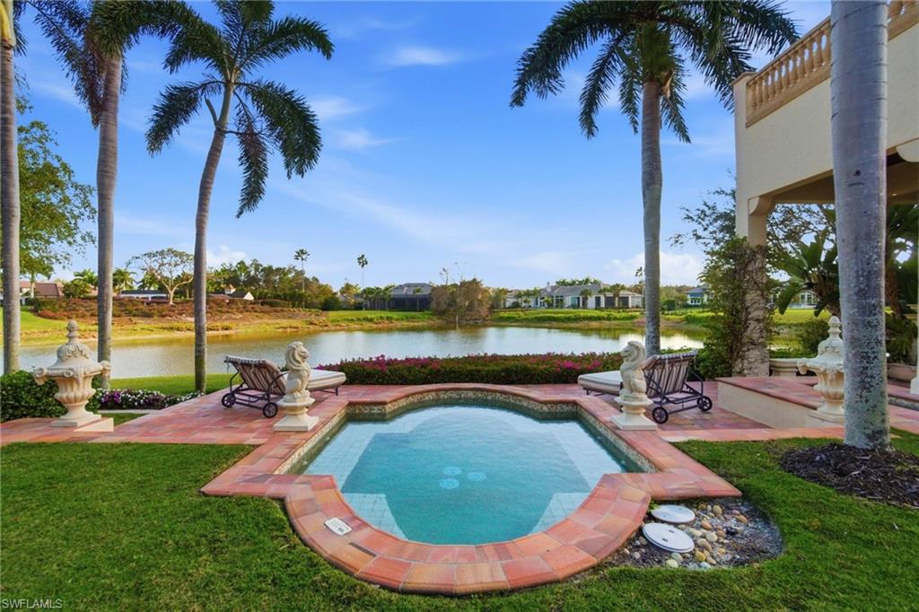28920 Cavell Terrace Naples, FL 34119 - Photo 5 of 50 a swimming pool with outdoor seating and garden