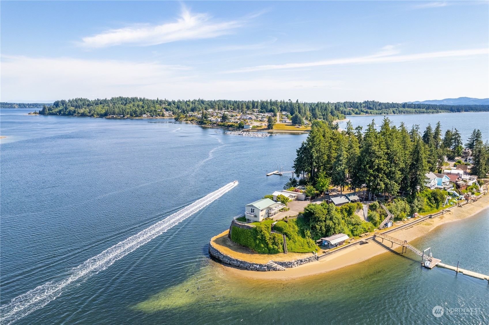 2942 Steamboat Island Road Northwest Olympia, WA 98502 - Photo 5 of 40 a view of a lake with a house