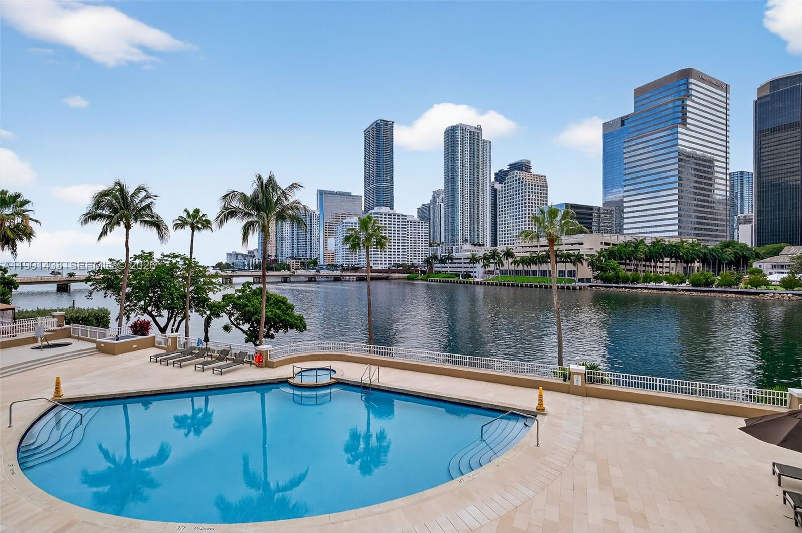 701 Brickell Key Boulevard, Unit 1108 Miami, FL 33131 - Photo 8 of 13 a view of a swimming pool with a lake view