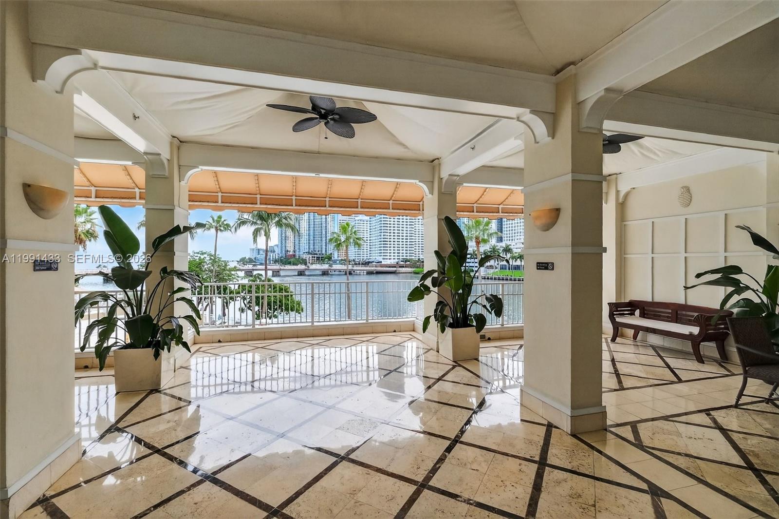 701 Brickell Key Boulevard, Unit 1108 Miami, FL 33131 - Photo 9 of 13 a living room with furniture