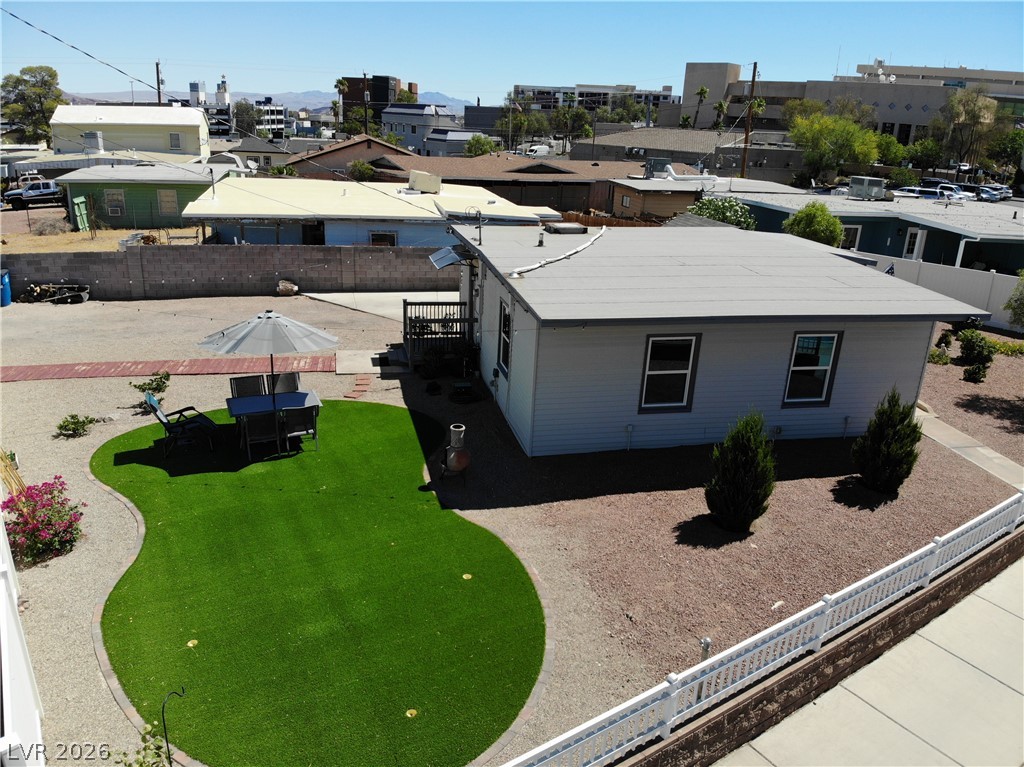 116 West Basic Road Henderson, NV 89015 - Photo 35 of 39 A private yard with an artificial turf patch and a patio seating area.