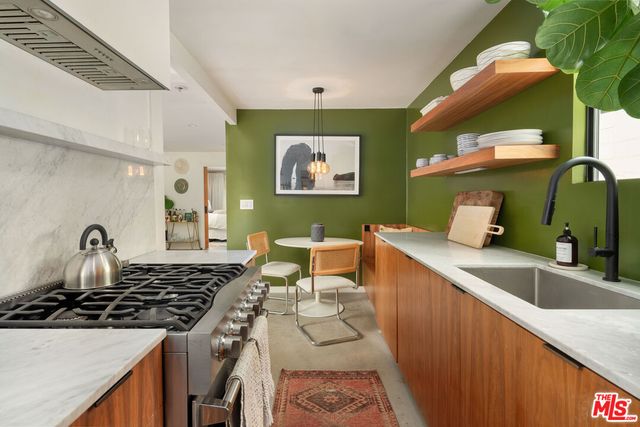 a bathroom with a toilet a sink and a mirror