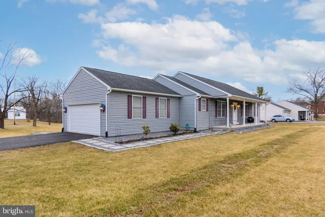 a kitchen with stainless steel appliances granite countertop a refrigerator sink and cabinets