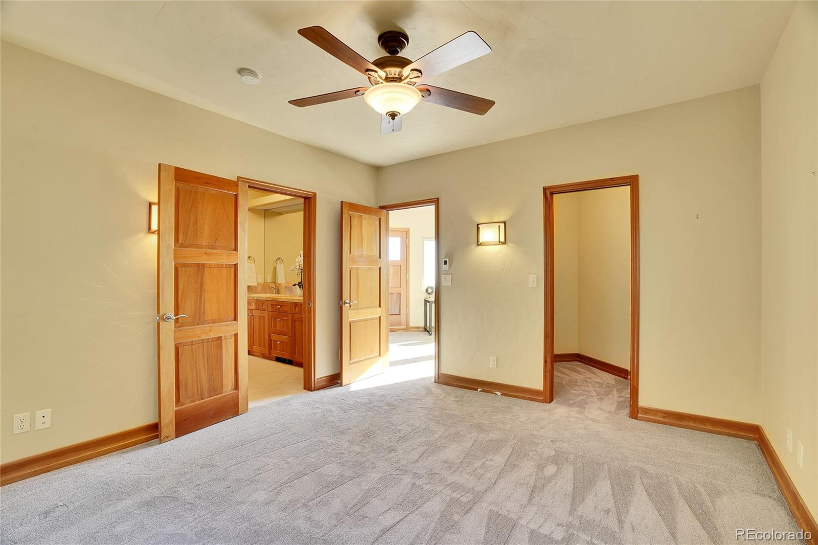 6057 Red Hill Road Boulder, CO 80302 - Photo 25 of 41 a view of a livingroom with a chandelier fan
