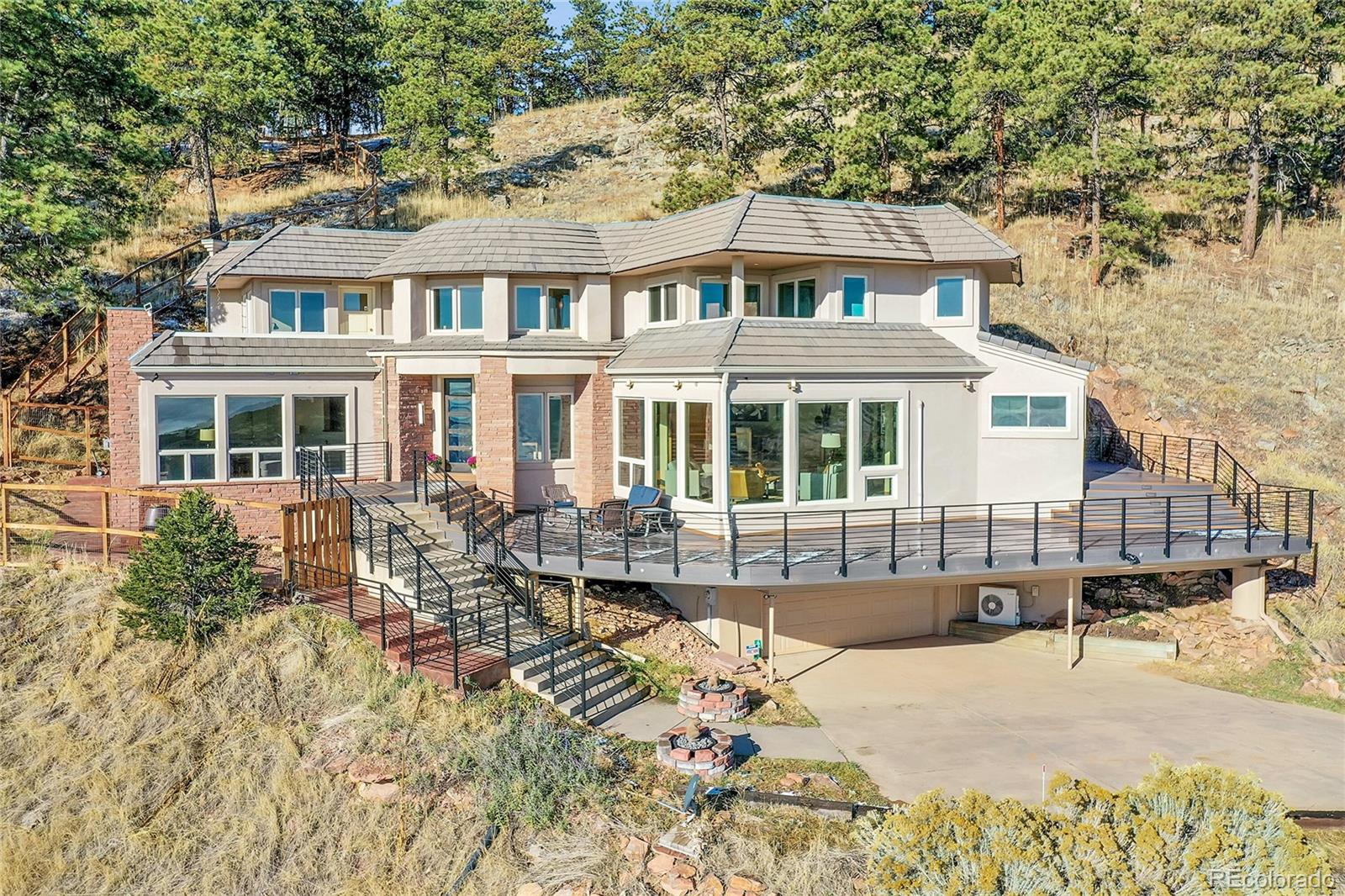 6057 Red Hill Road Boulder, CO 80302 - Photo 34 of 41 a front view of a house with a yard outdoor seating and barbeque oven
