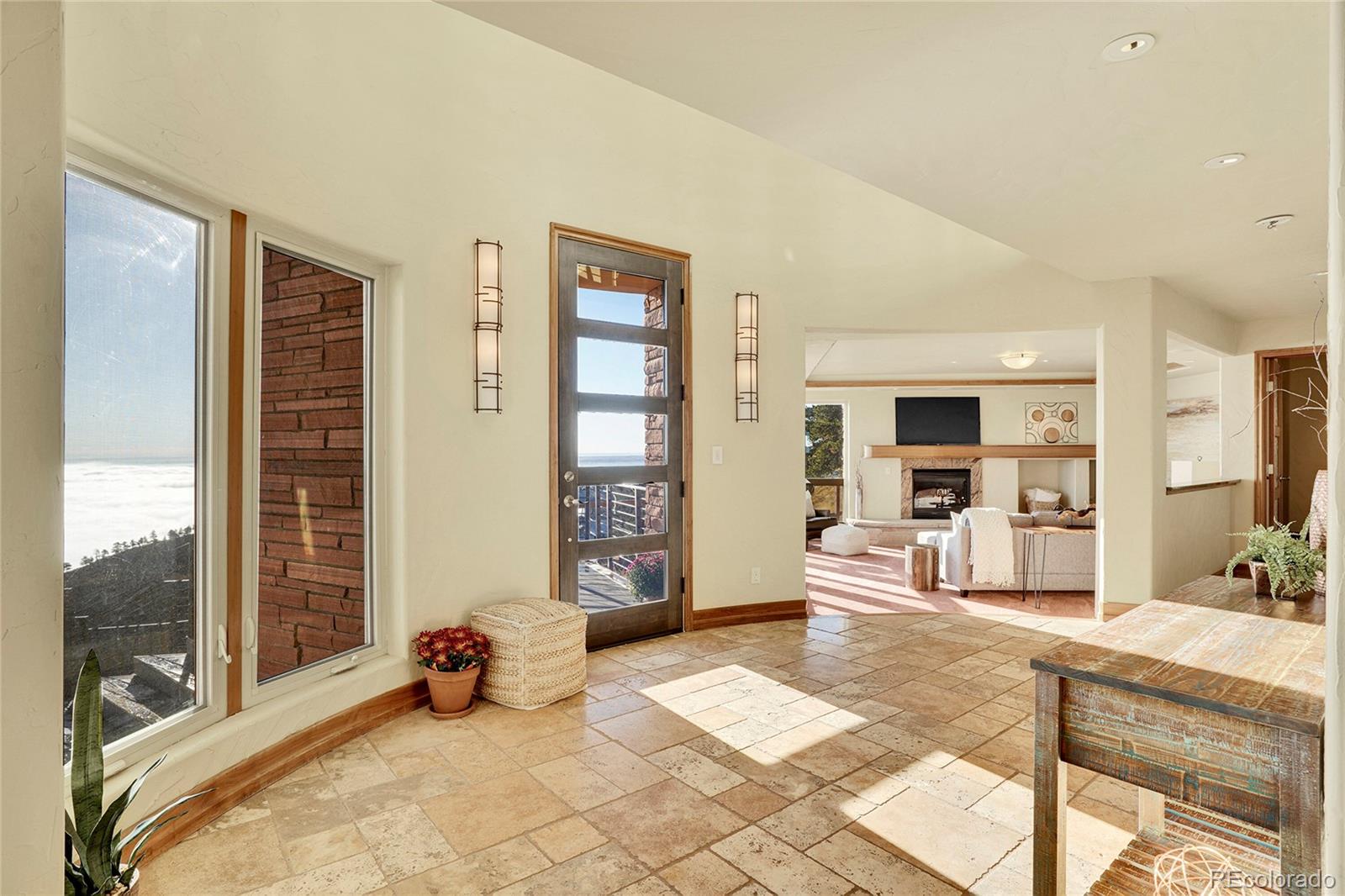 6057 Red Hill Road Boulder, CO 80302 - Photo 5 of 41 a room with furniture and large windows