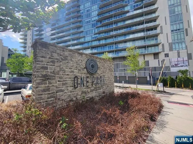 a backyard of a building with chairs