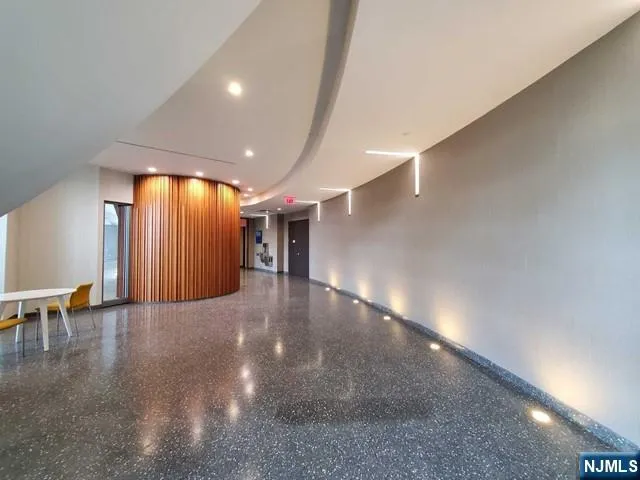 a view of a hallway with staircase