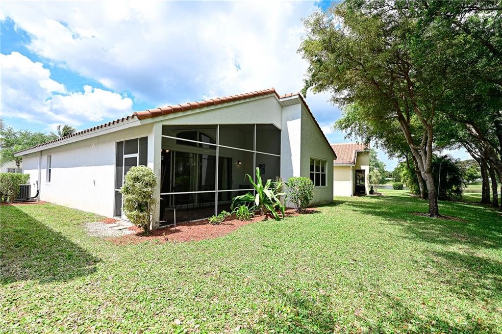 9290 Springview Loop Estero, FL 33928 - Photo 16 of 25 a view of a house with backyard and garden