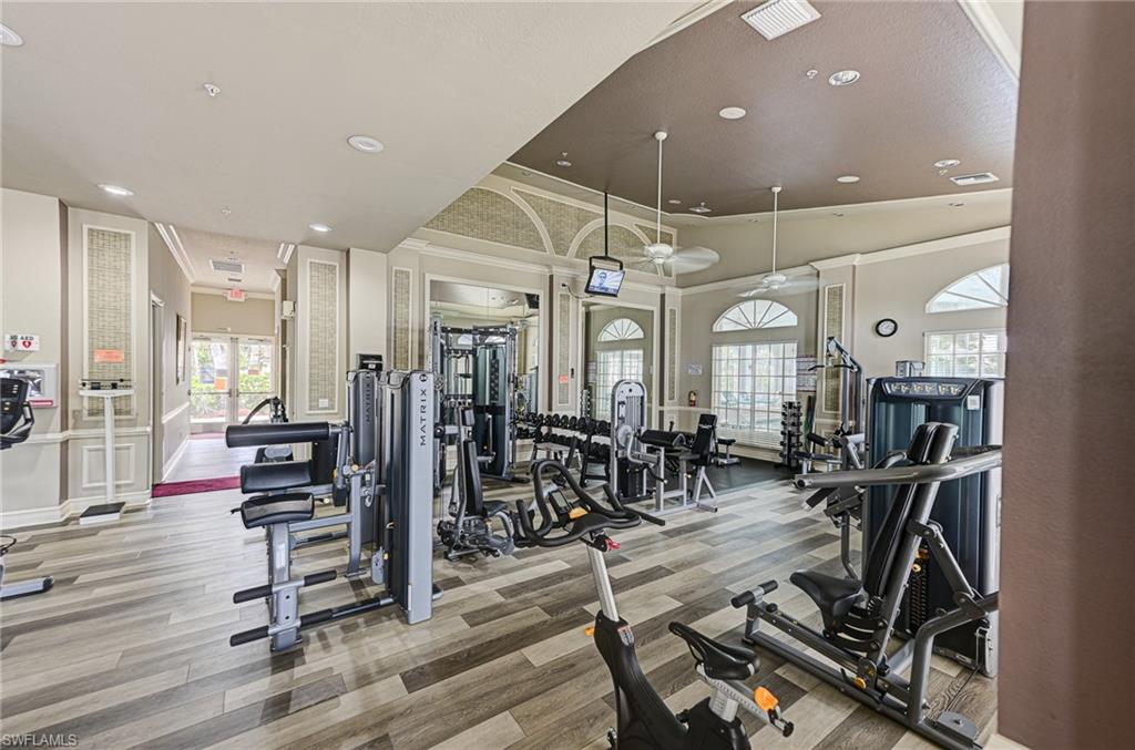 9290 Springview Loop Estero, FL 33928 - Photo 21 of 25 a view of a room with gym equipment