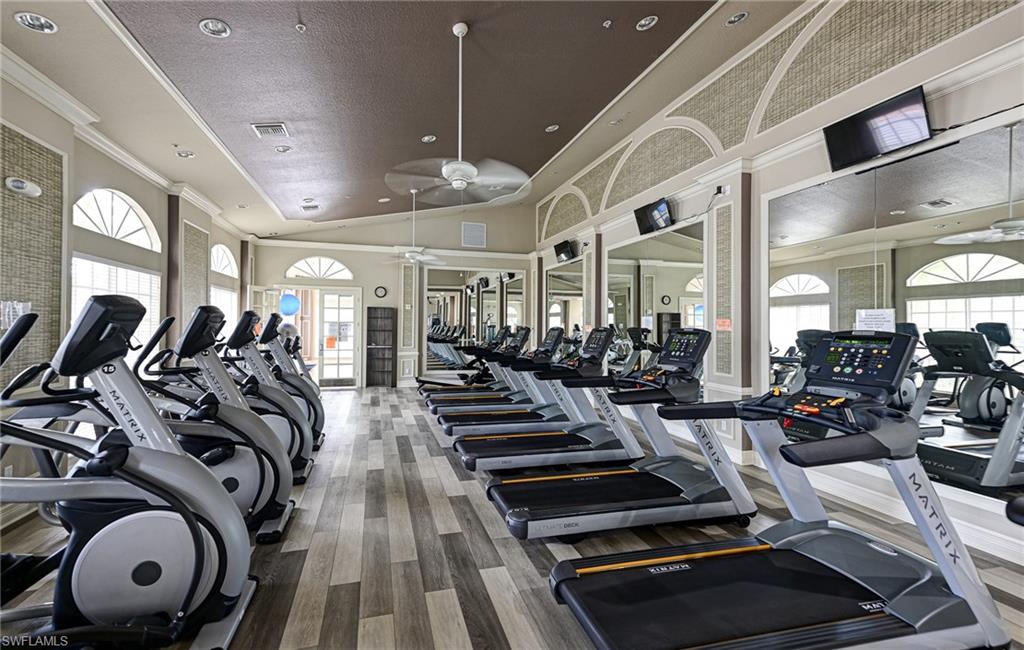 9290 Springview Loop Estero, FL 33928 - Photo 22 of 25 a view of a room with gym equipment